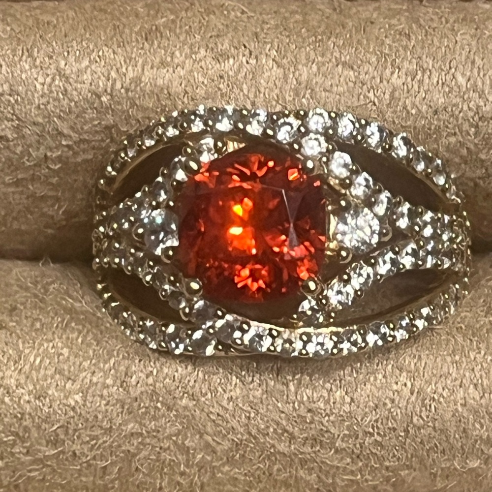 Gold plated simulated padparadscha stone with white simulated diamonds